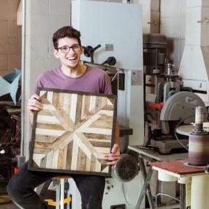 A CUAA student cultivates a talent for turning reclaimed wood into art