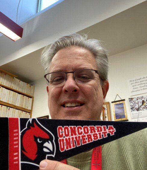 Scott Kamman shows his Cardinal pride as a teacher in Louisville, Kentucky. 