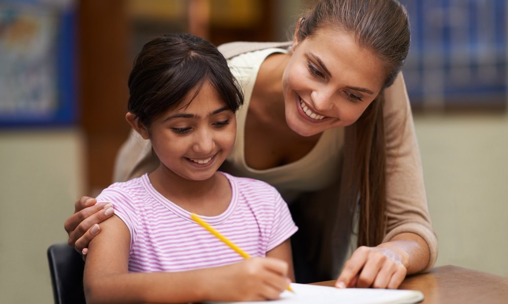 Teacher working with student