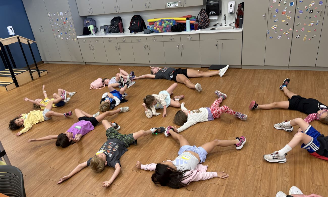 kids stretching on ground