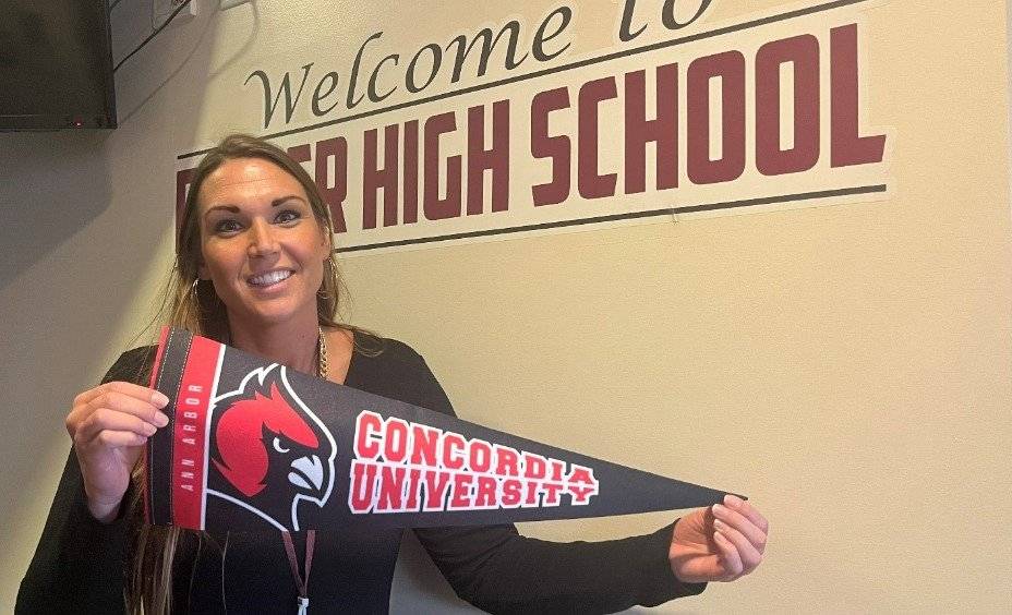 Melanie Nowak shows her Cardinal pride as principal of Dexter High School