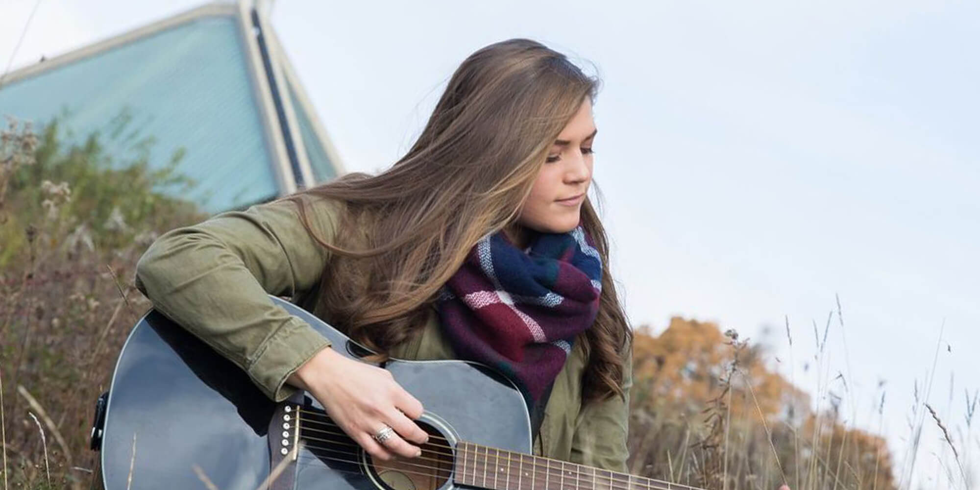 Grace playing the guitar