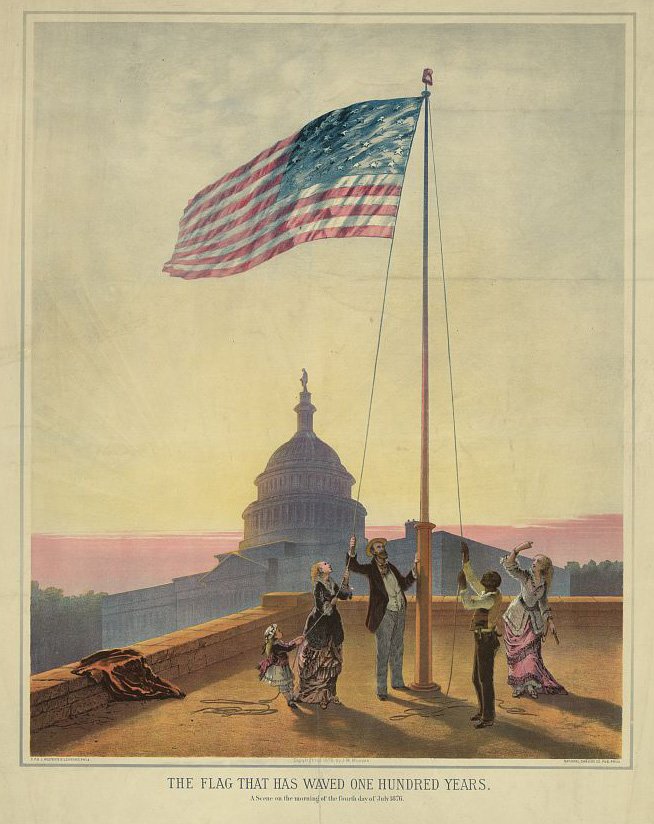 old picture of flag and people raising it